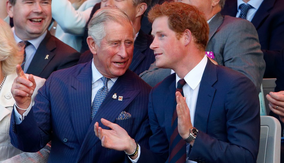 Prince Charles, Prince of Wales and Prince Harry (wearing the regimental tie of the Household Division) attend the Opening Ceremony of the Invictus Games at the Queen Elizabeth Olympic Park on September 10, 2014 in London, England.