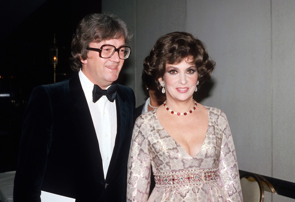  NEW YORK, NY - ARPIL 11: English composer, lyricist, and playwright Leslie Bricusse and actress Gina Lollobrigida are photographed at the wedding of Governor Hugh Carey and Evangeline Gouletas April 11, 1981 in New York City.