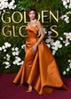 A 2025-ös Golden Globe-díjátadón egy drámai uszállyal ellátott, égetett narancs színű Louis Vuitton ruhakölteményben tündökölt, amit egy Bulgari gyémántnyakékkel koronázott meg.  